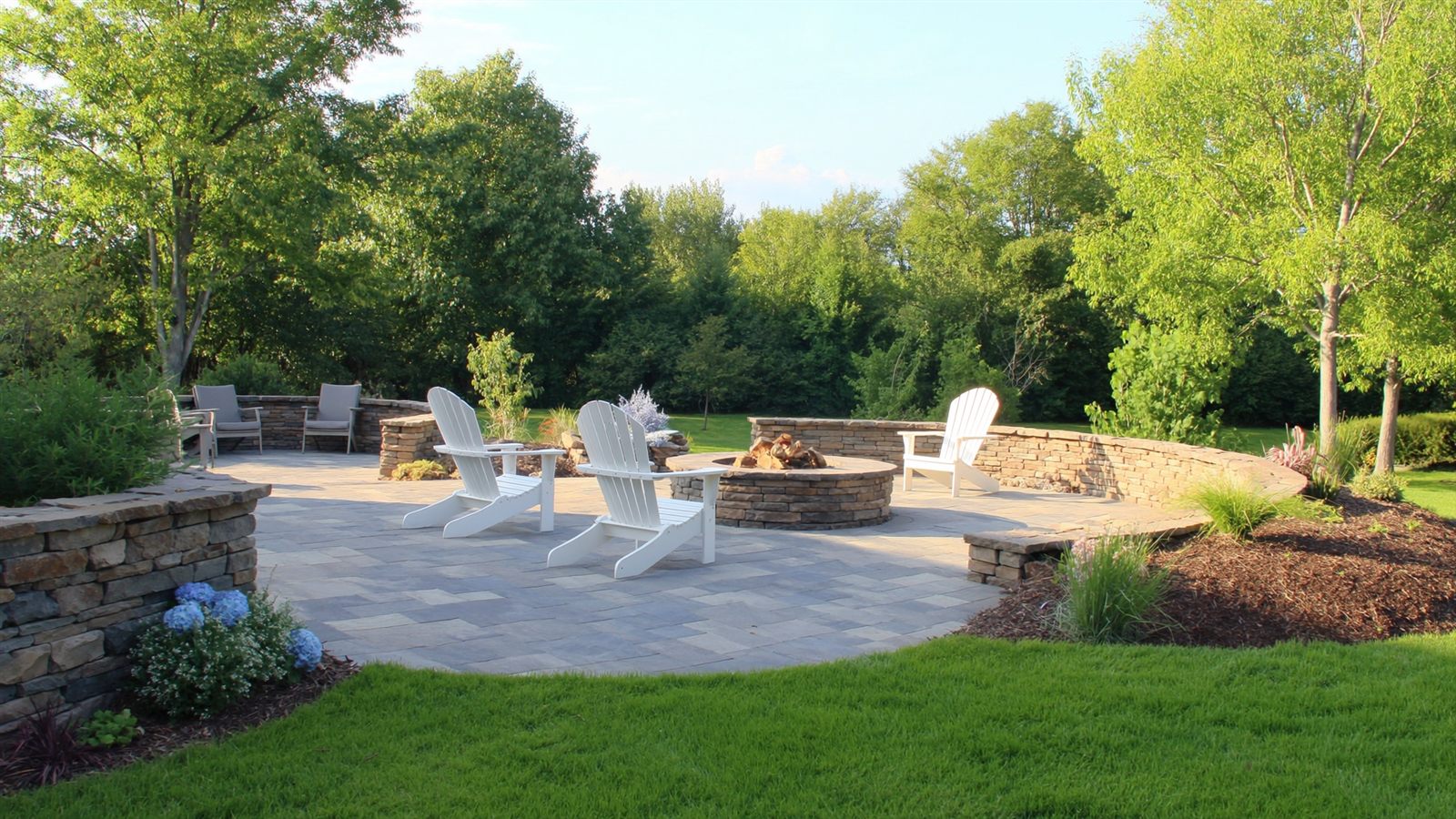 Stone paver patio with fire pit built by Heritage Landscaping